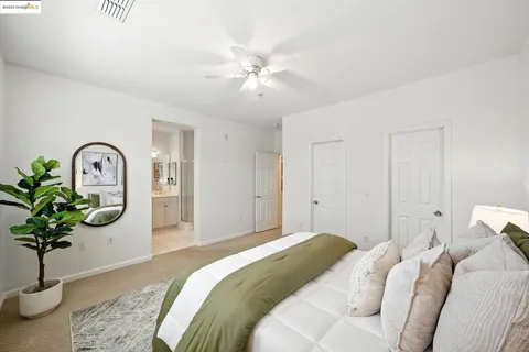a bathroom with a bathtub a sink a large mirror and shower