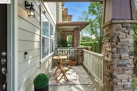 a view of a chair and table in the balcony