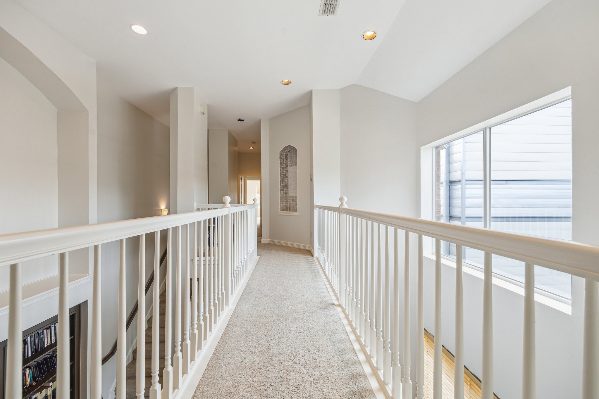 1202 Marconi Street Houston, TX 77019 - Photo 14 of 23 a view of a hallway with windows
