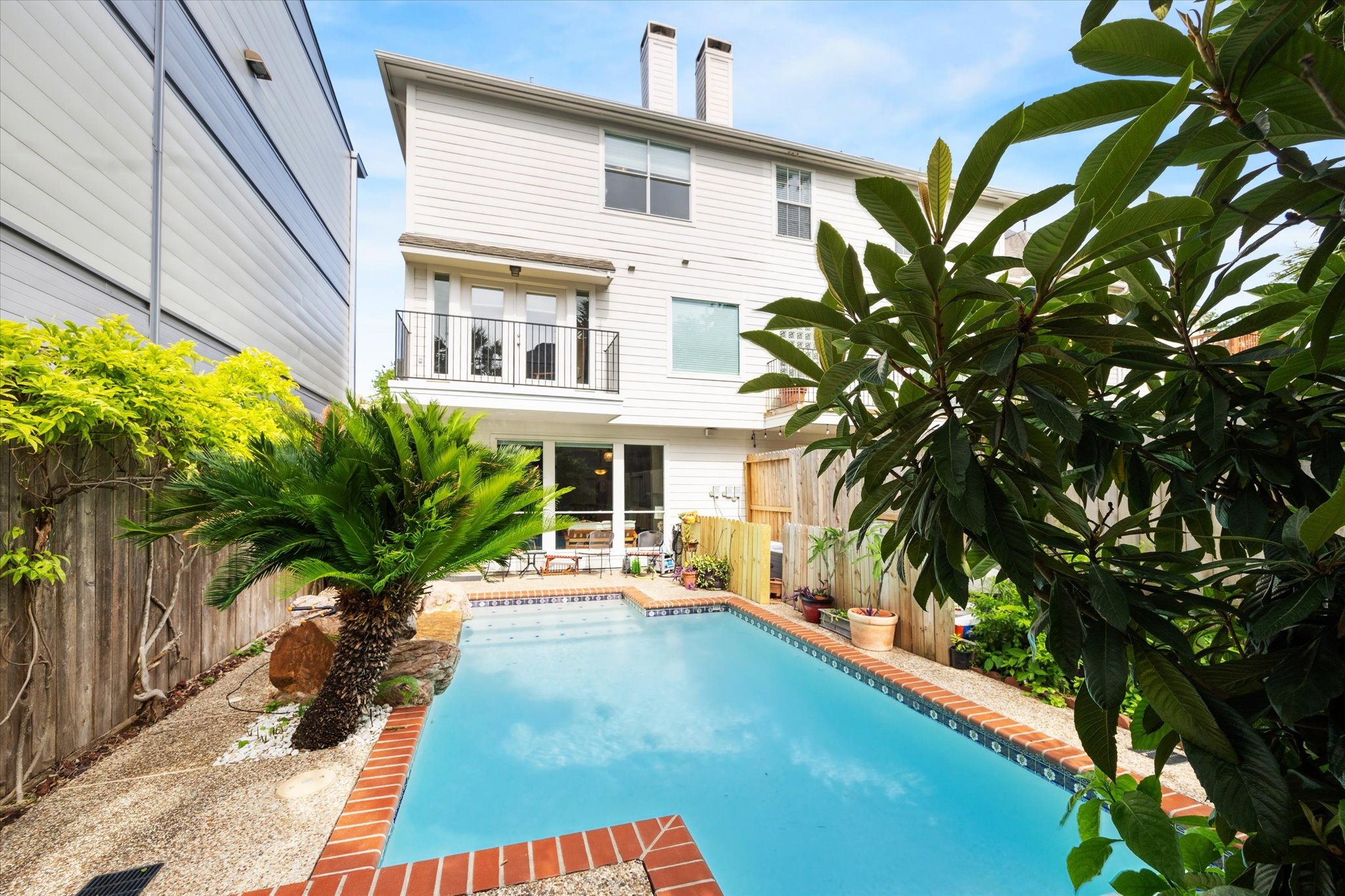 1202 Marconi Street Houston, TX 77019 - Photo 17 of 23 a house with palm tree in front of it