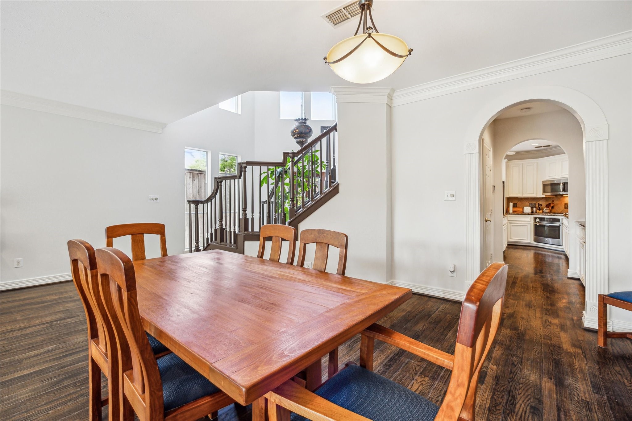 1202 Marconi Street Houston, TX 77019 - Photo 5 of 23 a view of a dining room with furniture and wooden floor