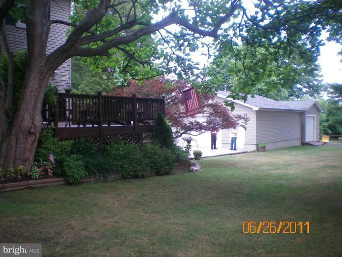 5105 Shelbourne Road Halethorpe, MD 21227 - Photo 1 of 30 a view of a house with a yard and tree s