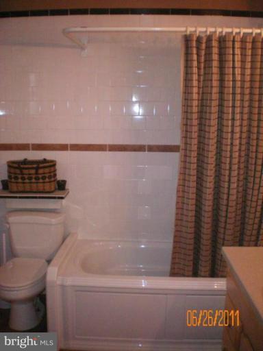5105 Shelbourne Road Halethorpe, MD 21227 - Photo 5 of 30 a bathroom with a toilet and a shower