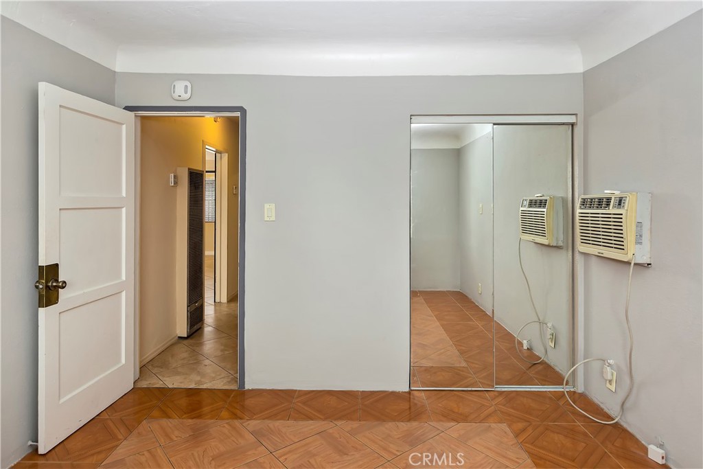617 South Chester Avenue Compton, CA 90221 - Photo 17 of 34 a view of a hallway with wooden floor and closet