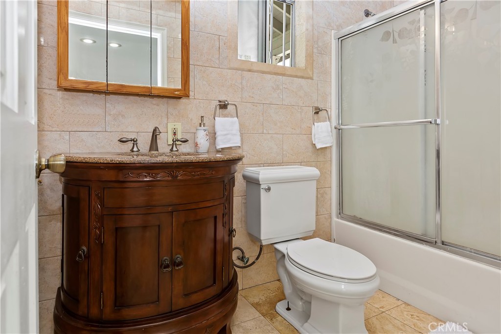 617 South Chester Avenue Compton, CA 90221 - Photo 23 of 34 a bathroom with a toilet and a sink