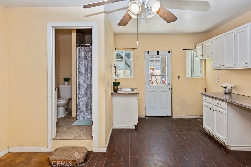 617 South Chester Avenue Compton, CA 90221 - Photo 24 of 34 a kitchen with stainless steel appliances wooden floor and a refrigerator
