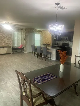 a view of a dining room with furniture
