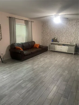 a living room with furniture and a couch