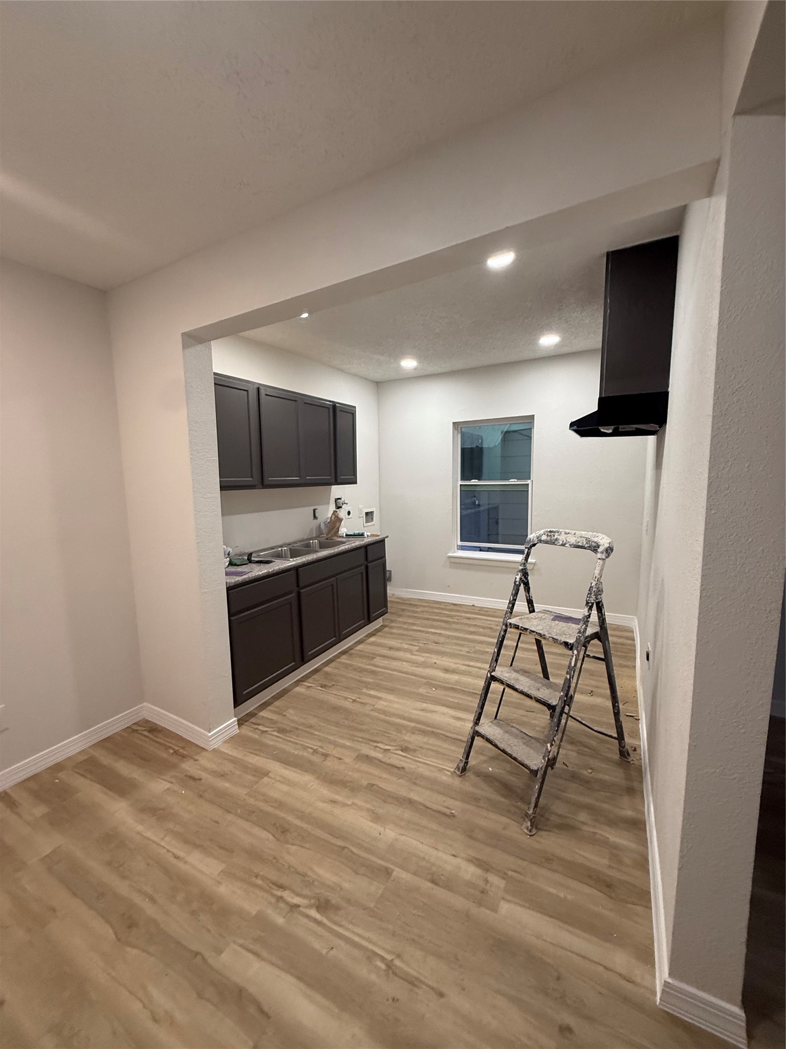 7023 Canal Street Houston, TX 77011 - Photo 3 of 9 a living room with a flat screen tv and a fireplace