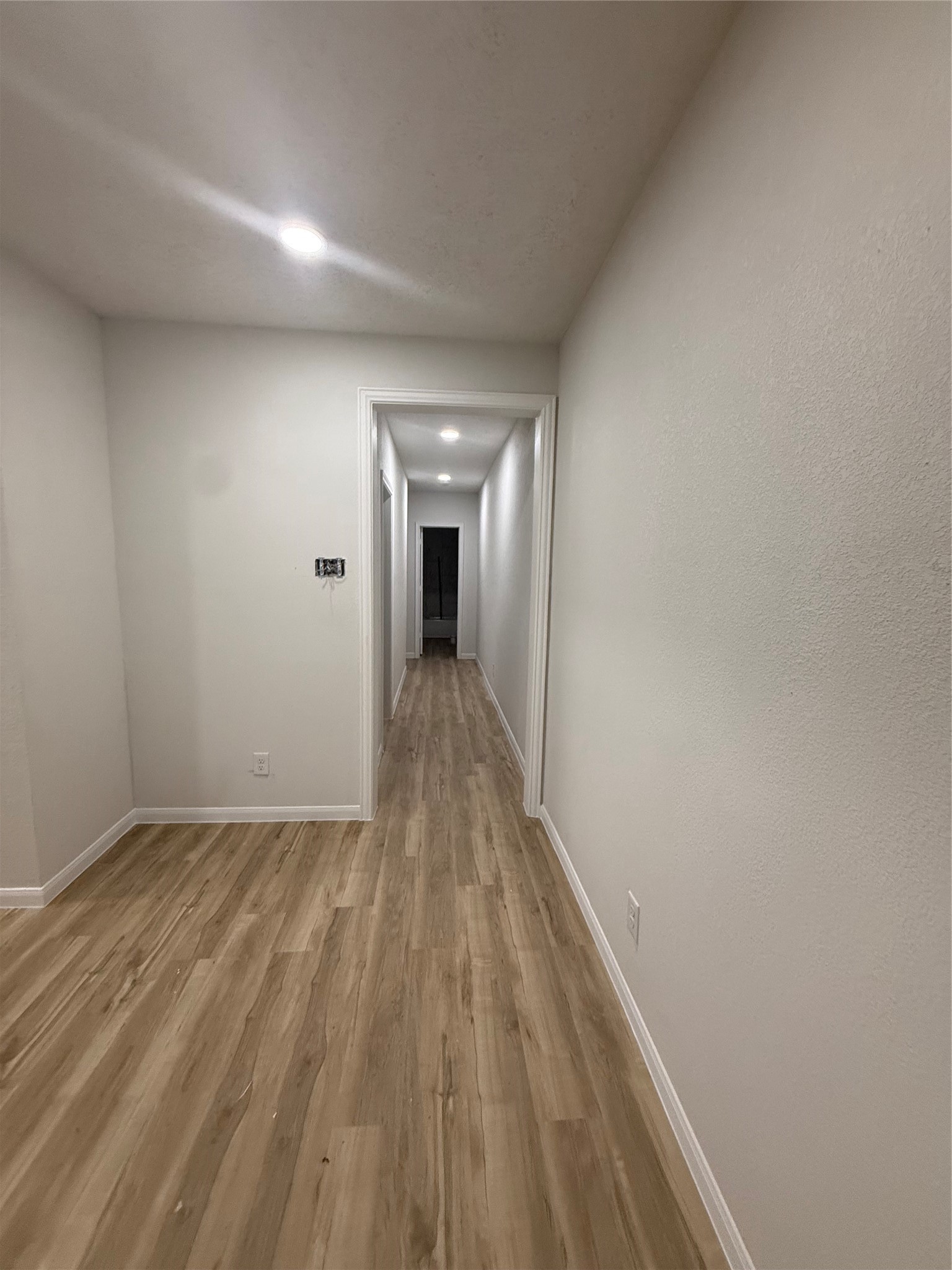 7023 Canal Street Houston, TX 77011 - Photo 7 of 9 a view of hallway with wooden floor