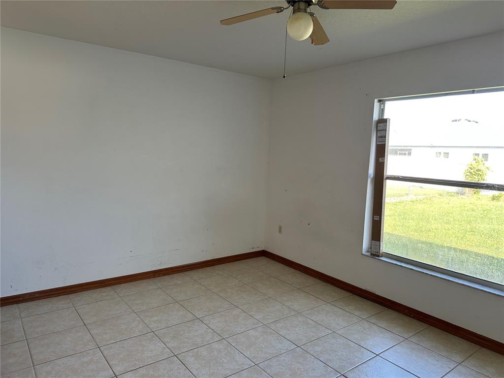 2454 Pine Chase Circle St. Cloud, FL 34769 - Photo 6 of 10 an empty room with a window