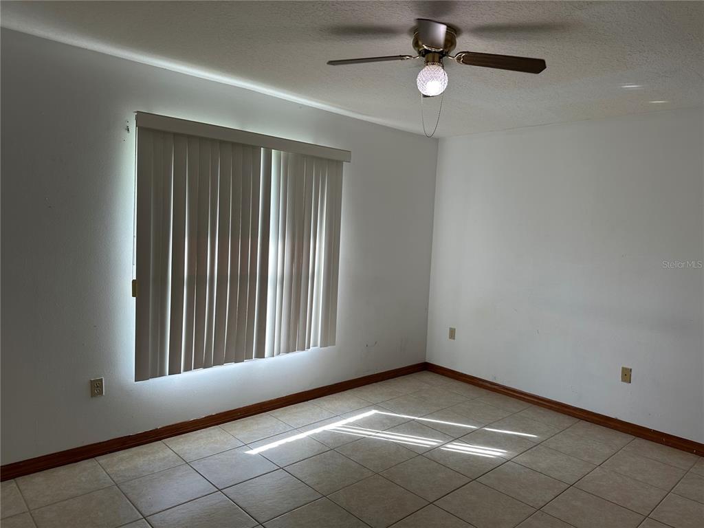 2454 Pine Chase Circle St. Cloud, FL 34769 - Photo 7 of 10 an empty room with windows