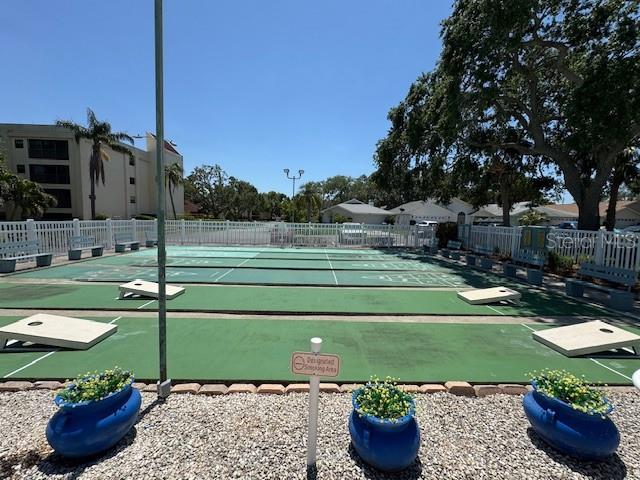 11485 Oakhurst Road, Unit 319 Largo, FL 33774 - Photo 57 of 63 a view of a backyard with sitting area