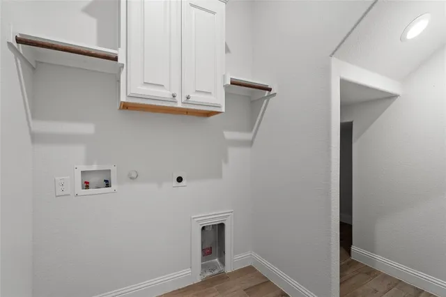 a view of cabinets and wooden floor