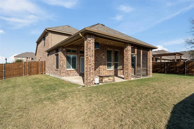 a view of a balcony with two windows