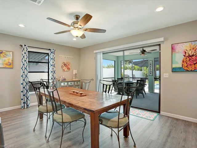 a dining room with furniture and window