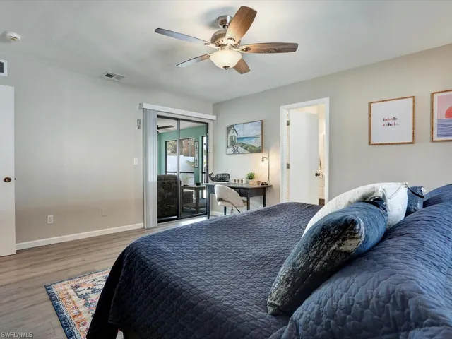 a bed room with a bed and a chandelier