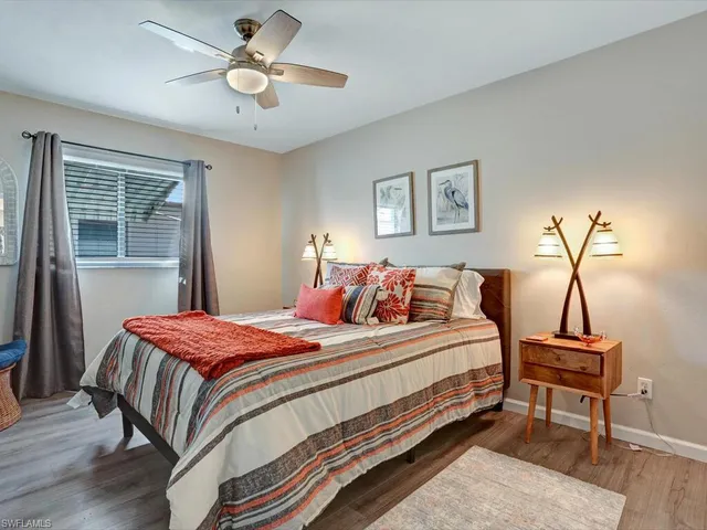 a bedroom with bed and a window