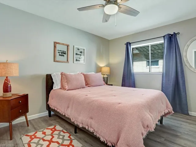 a bedroom with bed and window