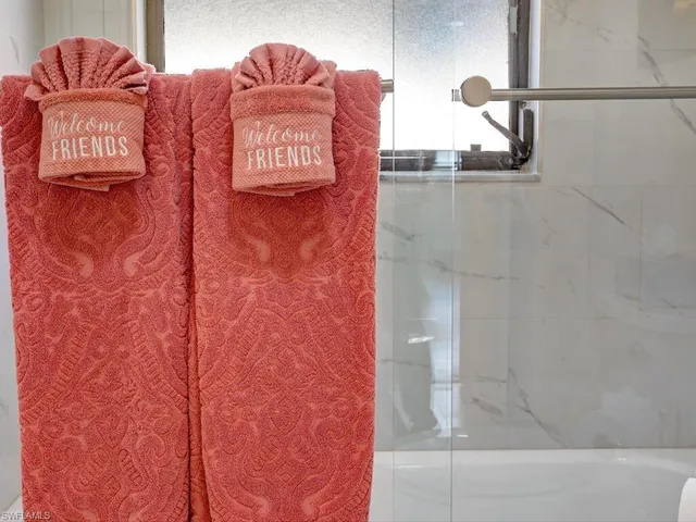 a bathroom with a shower and a sink