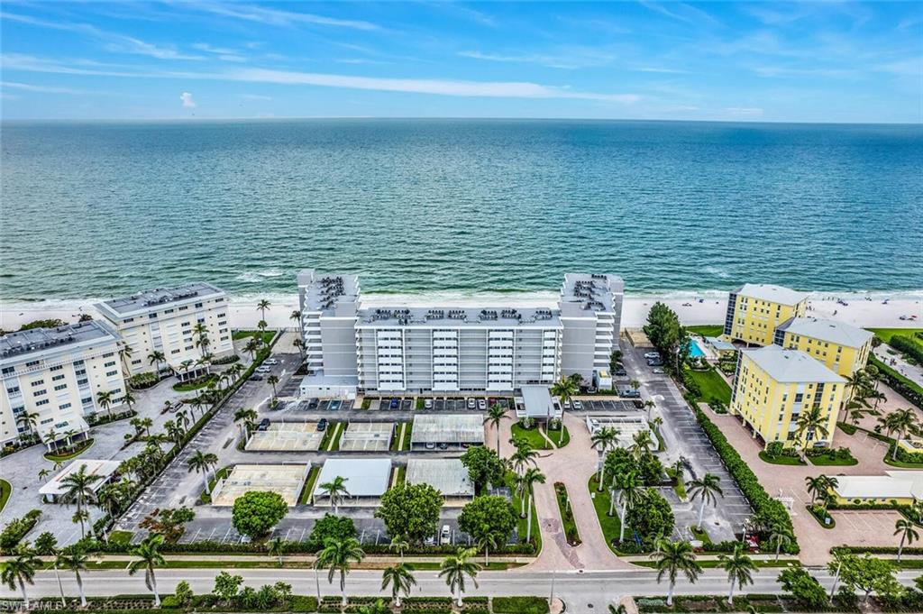 3443 Gulf Shore Boulevard North, Unit 710 Naples, FL 34103 - Photo 26 of 29 a view of building with an ocean view