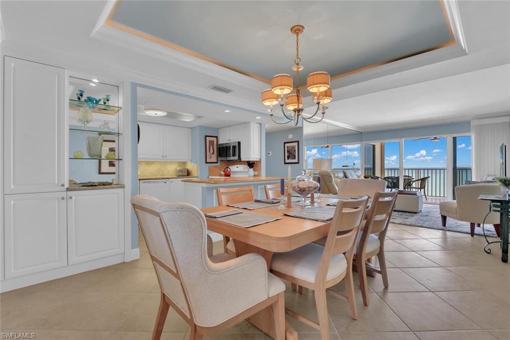 3443 Gulf Shore Boulevard North, Unit 710 Naples, FL 34103 - Photo 7 of 29 a view of a dining room and livingroom view