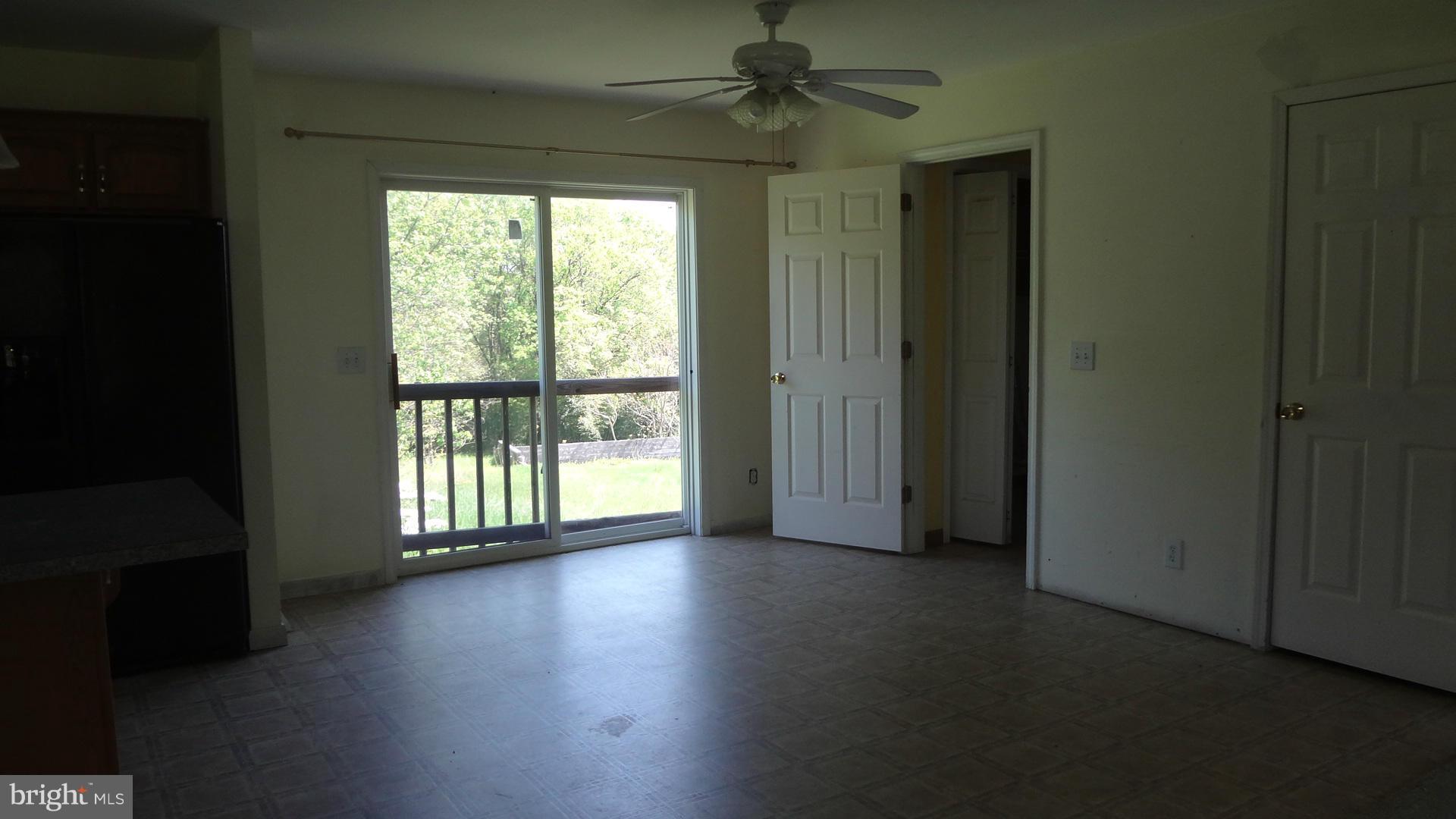 3545 Hopeland Road Frederick, MD 21704 - Photo 5 of 16 wooden floor in an empty room with a window