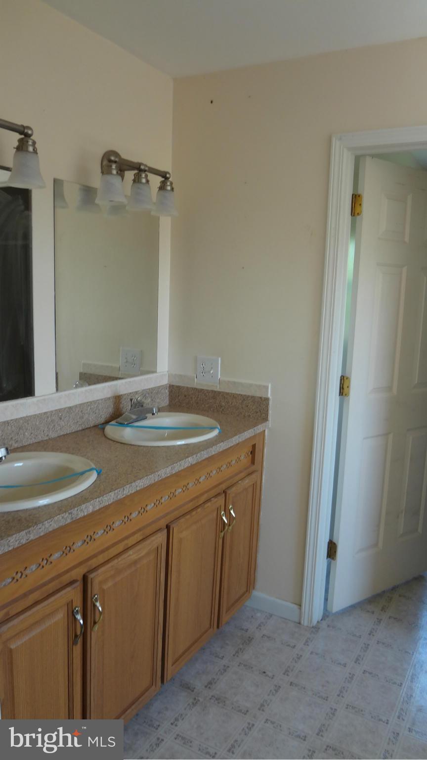 3545 Hopeland Road Frederick, MD 21704 - Photo 9 of 16 a bathroom with a sink and a mirror
