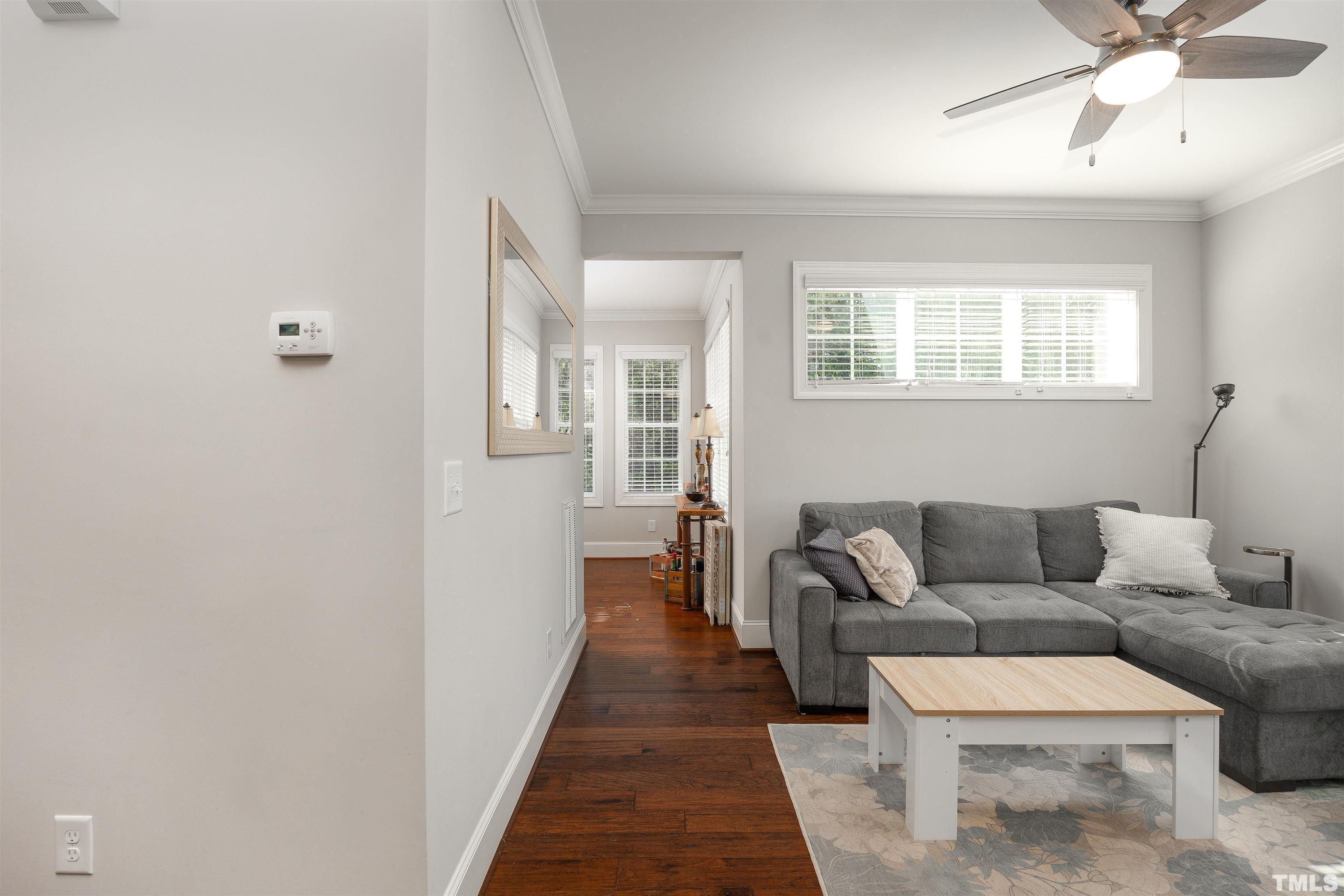 2829 Plumfield Place Raleigh, NC 27607 - Photo 11 of 26 a living room with furniture and a rug