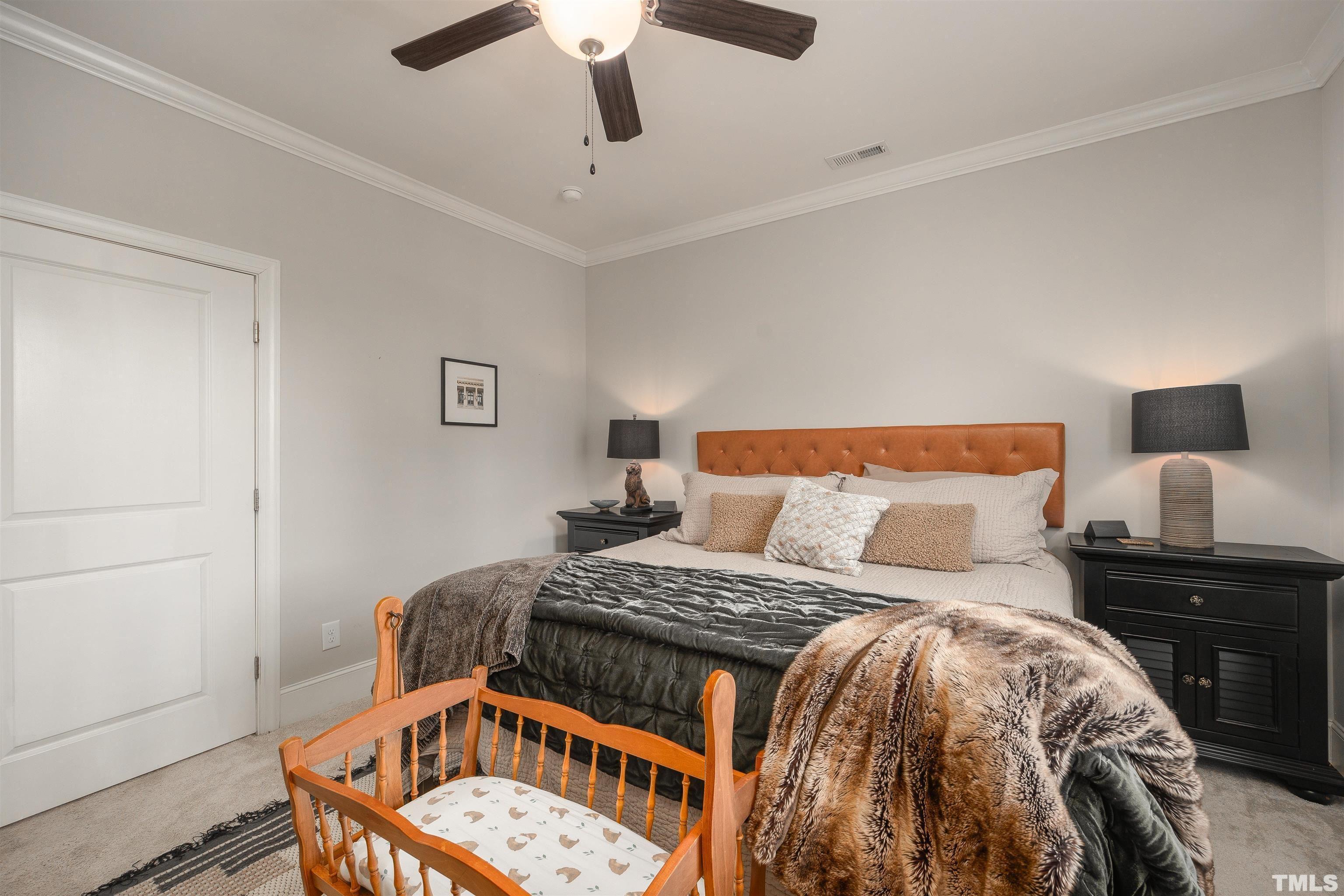 2829 Plumfield Place Raleigh, NC 27607 - Photo 15 of 26 a bedroom with a bed and dresser