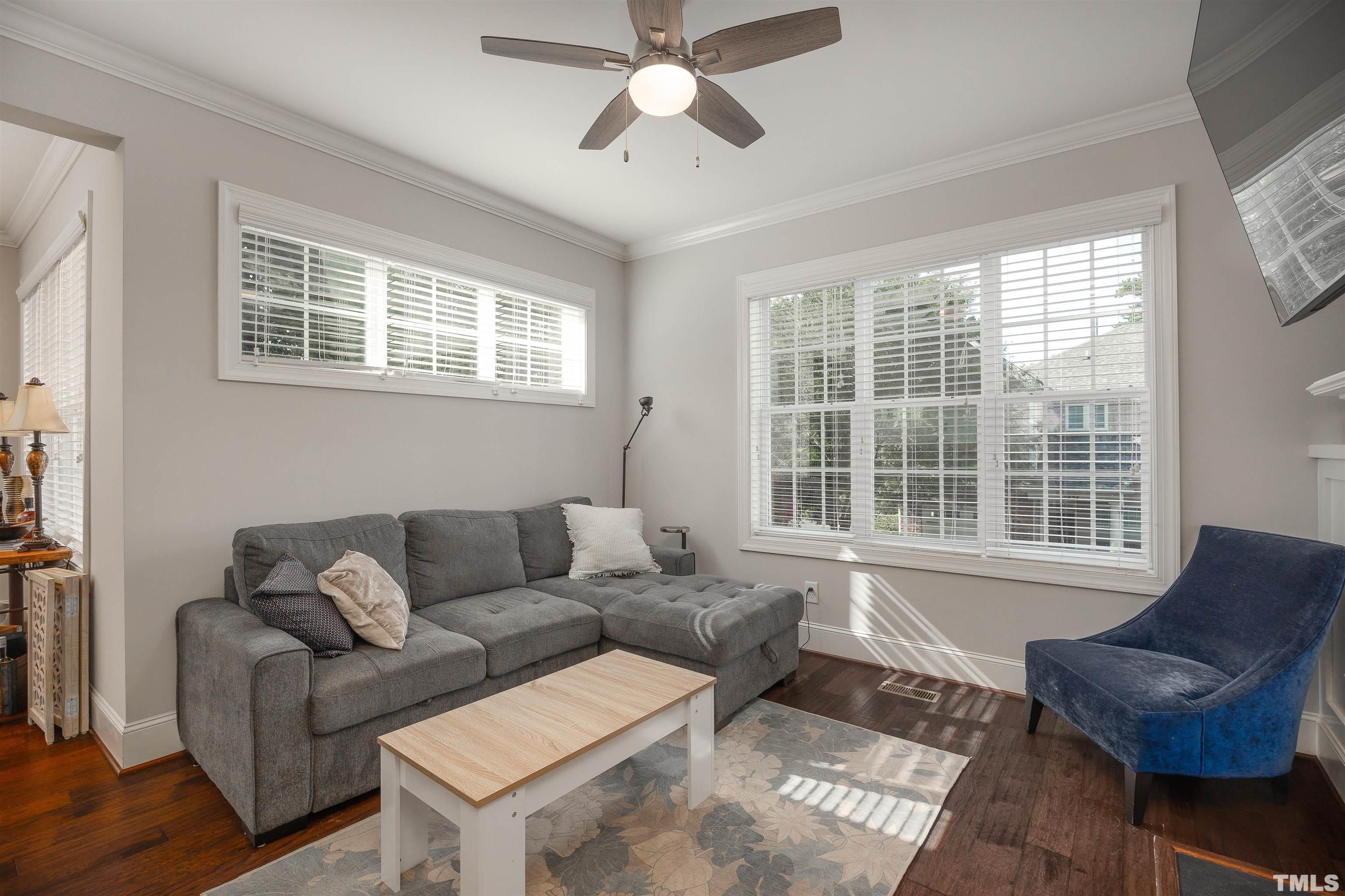 2829 Plumfield Place Raleigh, NC 27607 - Photo 2 of 26 a living room with furniture and a large window