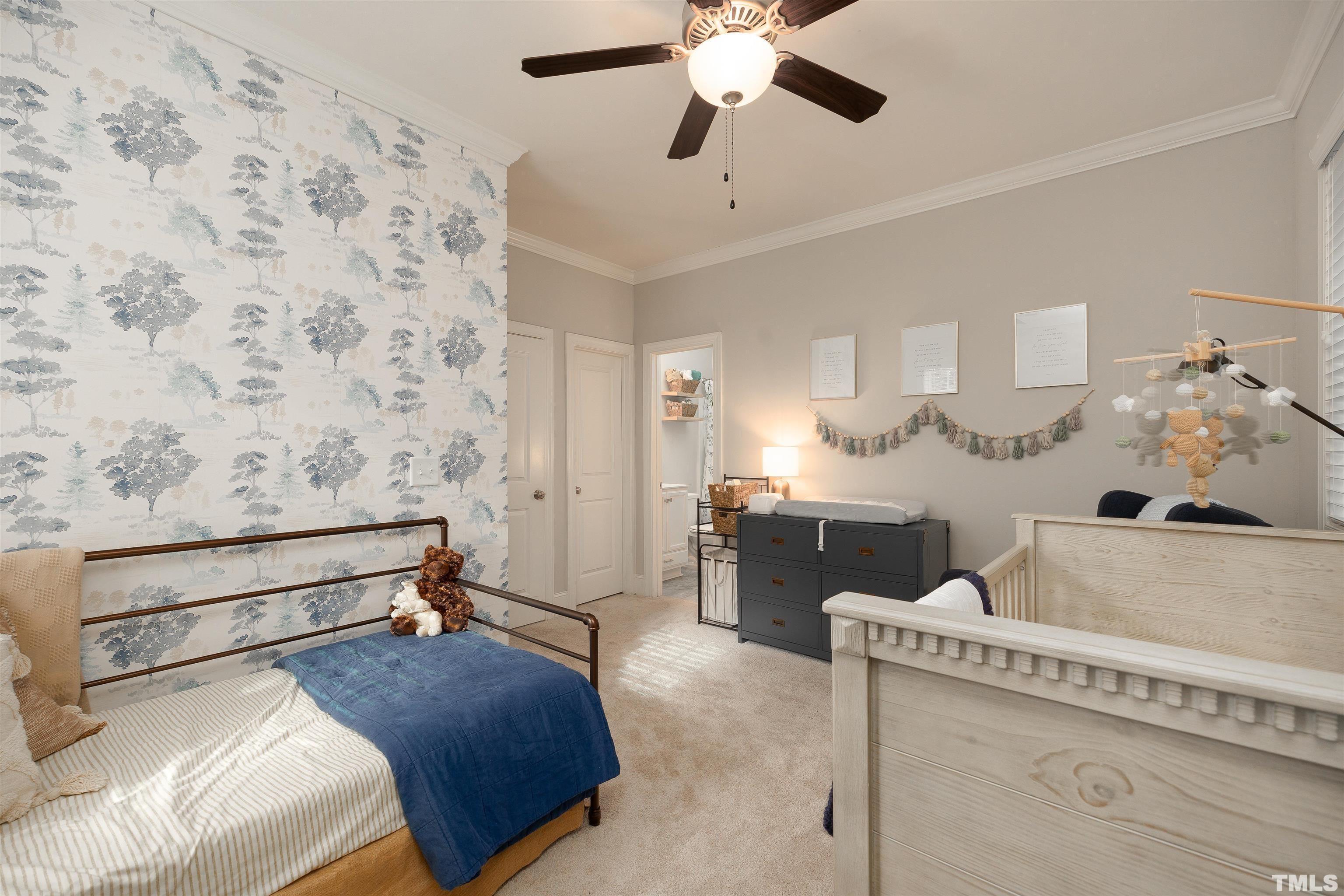 2829 Plumfield Place Raleigh, NC 27607 - Photo 21 of 26 a bedroom with a bed and a chandelier