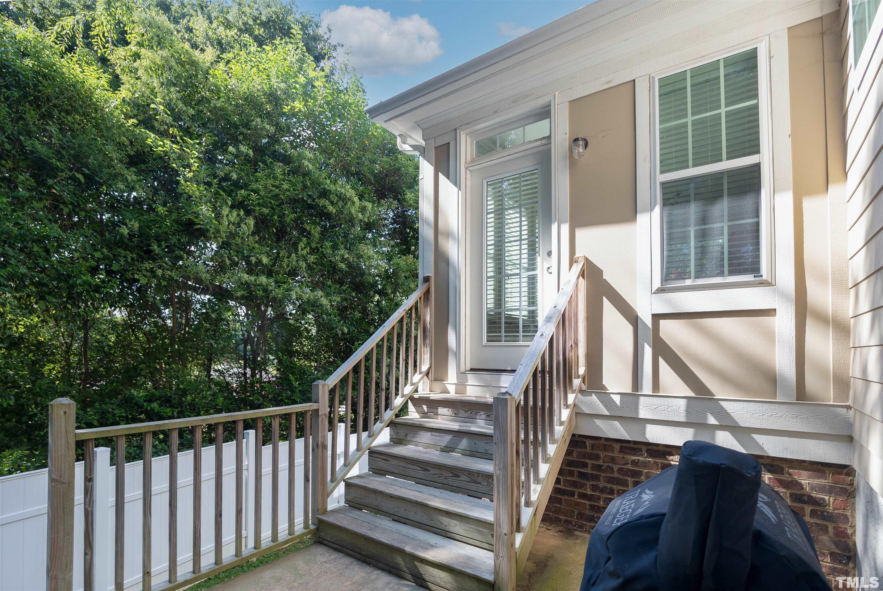 2829 Plumfield Place Raleigh, NC 27607 - Photo 22 of 26 a view of balcony with wooden floor and fence