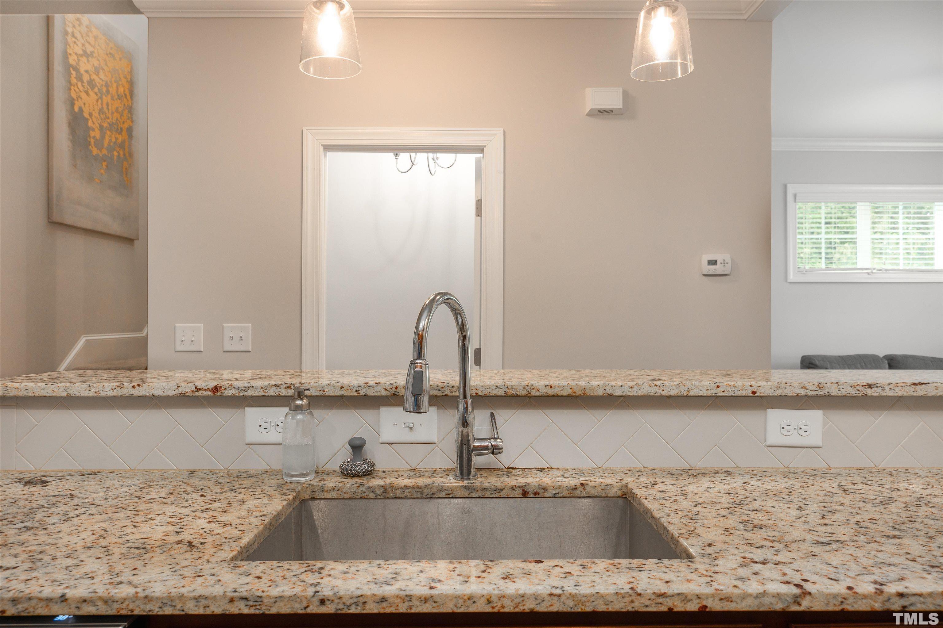 2829 Plumfield Place Raleigh, NC 27607 - Photo 26 of 26 a kitchen with granite countertop a sink and a stove
