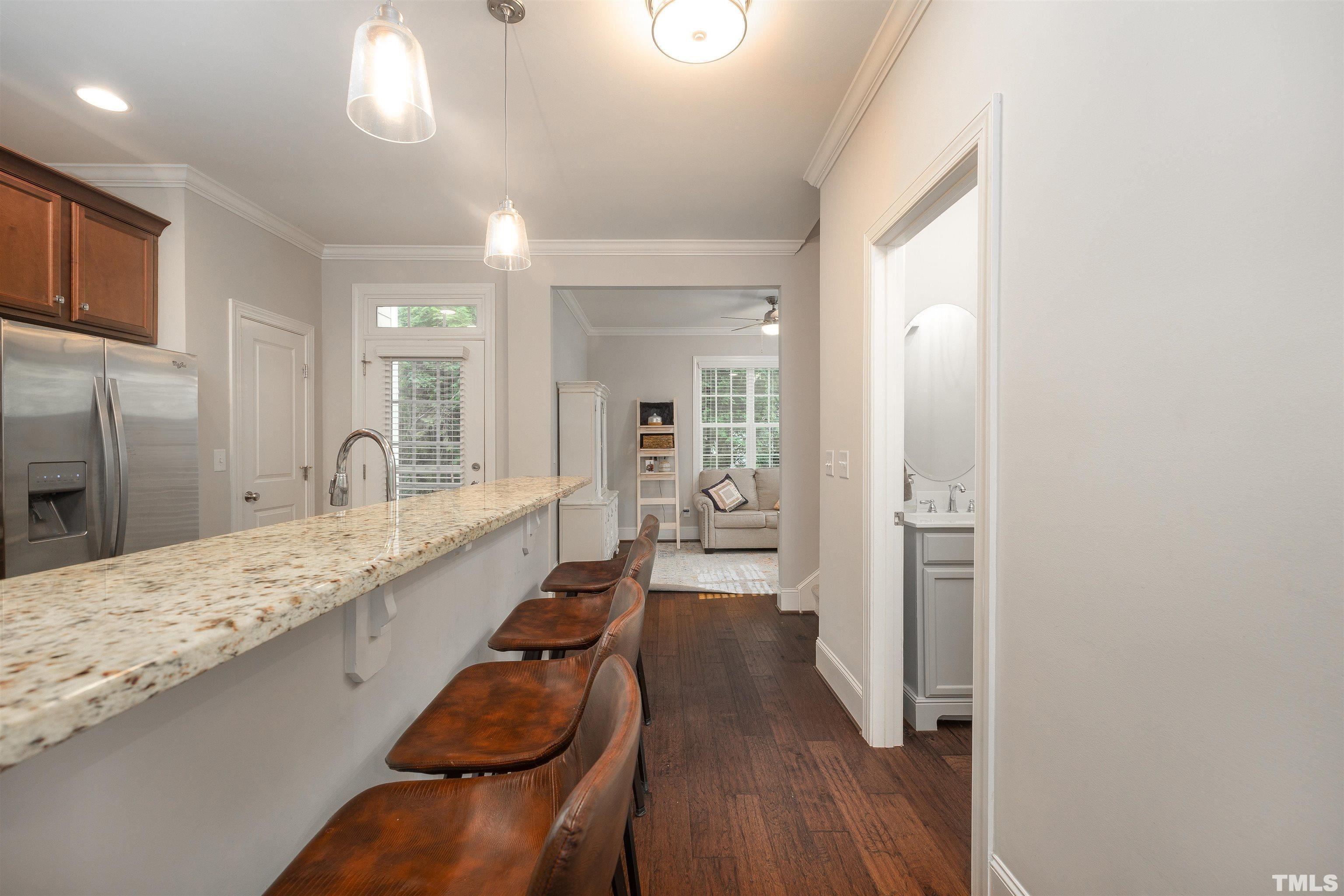 2829 Plumfield Place Raleigh, NC 27607 - Photo 7 of 26 a bathroom with a granite countertop sink a toilet and shower