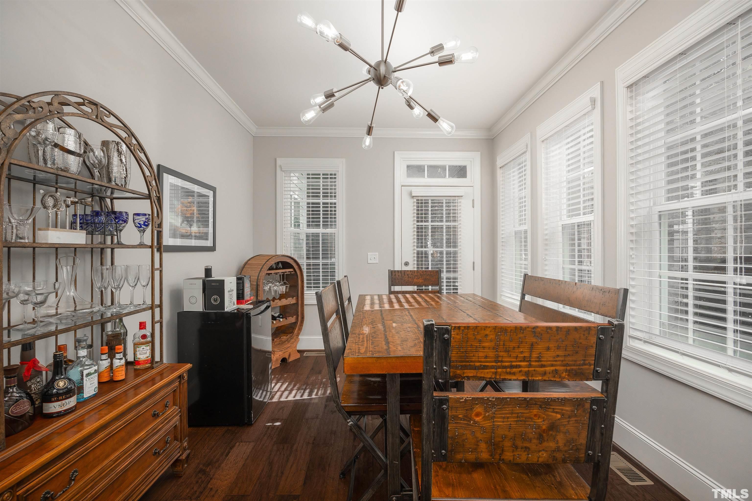 2829 Plumfield Place Raleigh, NC 27607 - Photo 9 of 26 a view of a dining room with furniture window and wooden floor