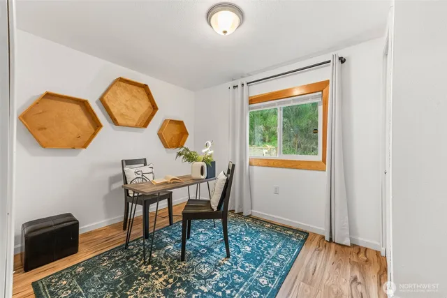 a workspace with furniture and a window