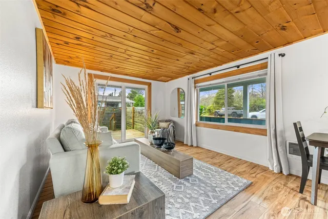 a living room with furniture and a table