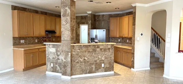 a bathroom with a granite countertop sink a mirror and a shower