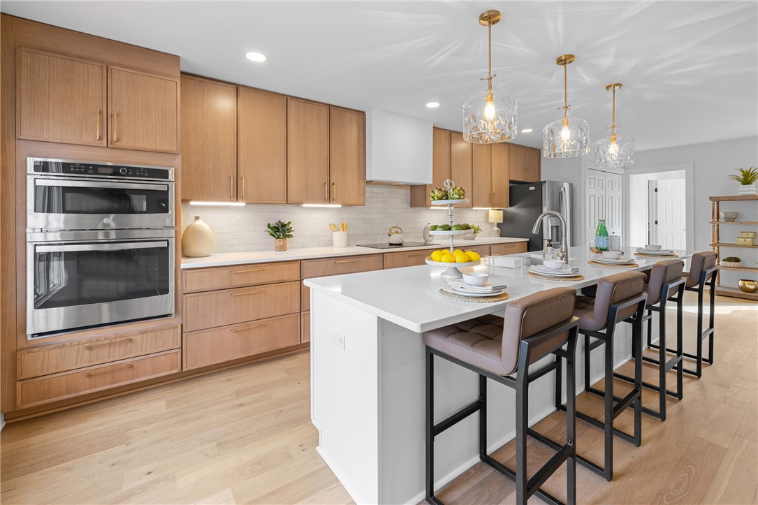 117 Riverpoint Drive Clemson, SC 29631 - Photo 17 of 47 This modern kitchen features a spacious island and high-end built-in appliances.
