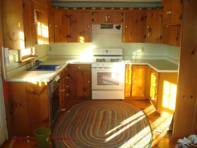 1318 County Road Cataumet, MA 02534 - Photo 3 of 7 a bathroom with a granite countertop sink and a mirror