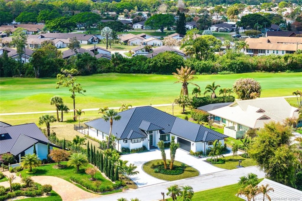 a view of a house with garden space and street view