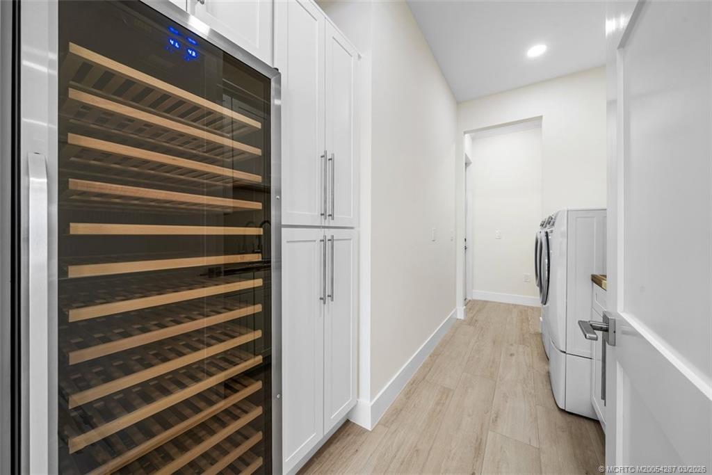 5101 Southeast Burning Tree Circle Stuart, FL 34997 - Photo 49 of 85 Wine cooler, laundry, storage, sink, changing area