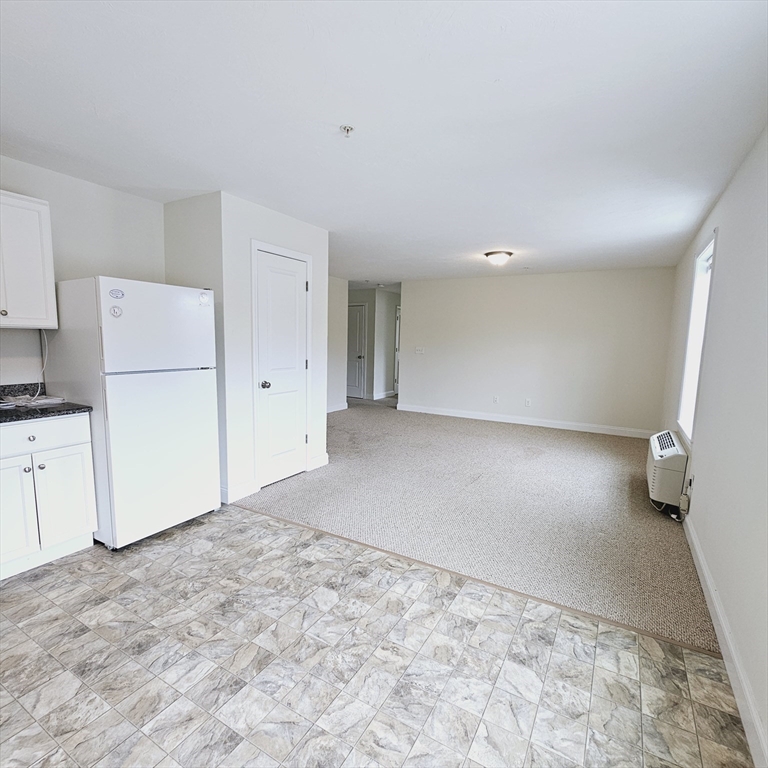 130 Spring Street, Unit 202 Mansfield, MA 02048 - Photo 3 of 23 a view of a kitchen with a sink