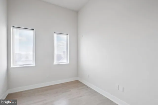 an empty room with windows