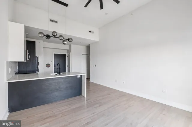 a view of a kitchen with a sink and a fireplace