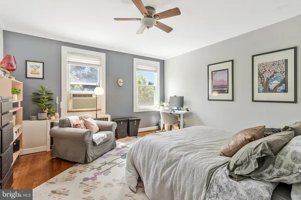 a bedroom with a balcony a bed and a couch