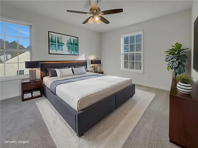 a bedroom with bed and a chandelier