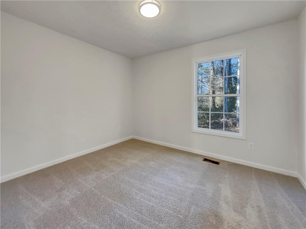 35 Grove Lane Temple, GA 30179 - Photo 16 of 25 an empty room with a window