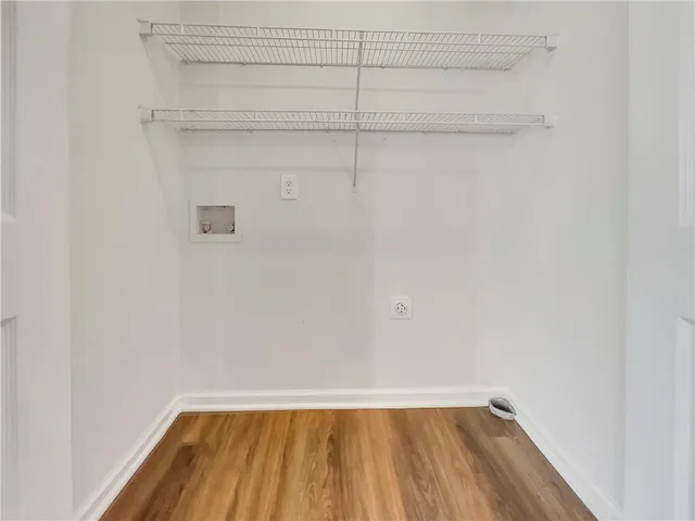 a view of a small space with racks on the wall